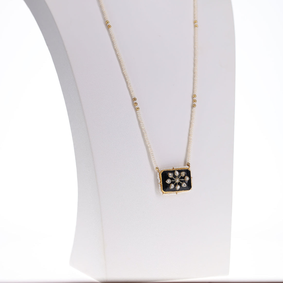 Gold plated 925 silver necklace with a black and white pendant and pearl strand