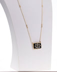 Gold plated 925 silver necklace with a black and white pendant and pearl strand