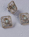 Set of snowflake-shaped stud earrings and a matching finger ring. Both pieces feature a Victorian design with semi-precious stones.