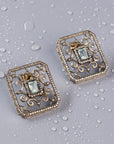 Highlighting the studs in the Set of snowflake-shaped stud earrings and a matching finger ring. Both pieces feature a Victorian design with semi-precious stones.