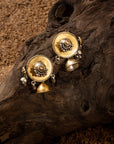 Two-tone jhumki earrings featuring a gold-plated stud with cascading beads and a silver tine jhumki with bead details.