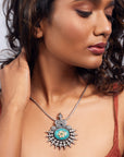 Turquoise pendant crafted from sterling silver featuring a genuine turquoise gemstone.