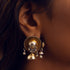 Two-tone jhumki earrings featuring a gold-plated stud with cascading beads and a silver tine jhumki with bead details.