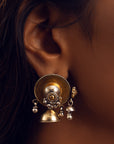 Two-tone jhumki earrings featuring a gold-plated stud with cascading beads and a silver tine jhumki with bead details.