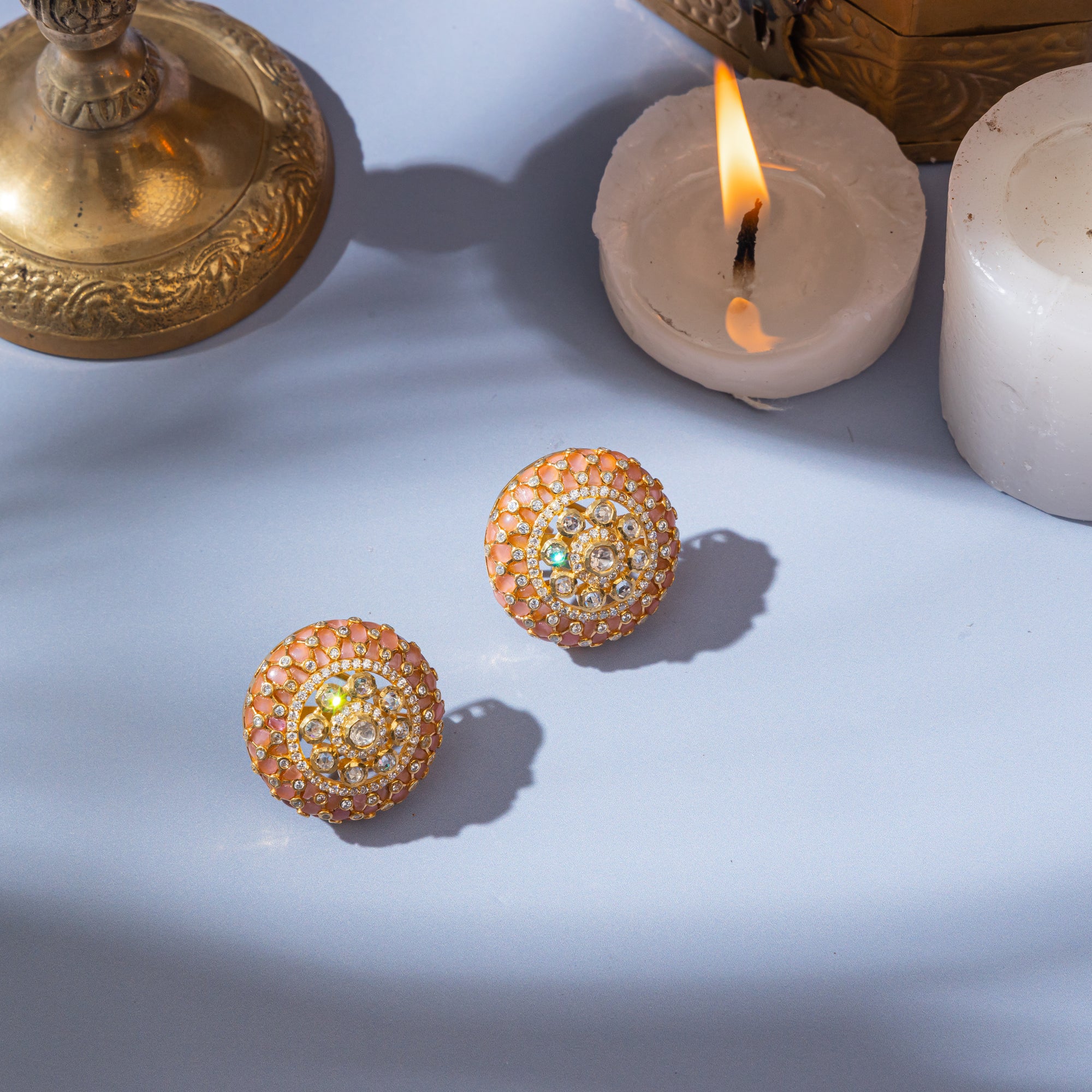 Delicate moissanite earrings in sterling silver with shimmering peach stones. 