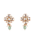 Silver stud earring featuring a floral motif with polki detailing, a pastel green bead, and cascading pearls.