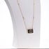 Gold plated 925 silver necklace with a black and white pendant and pearl strand